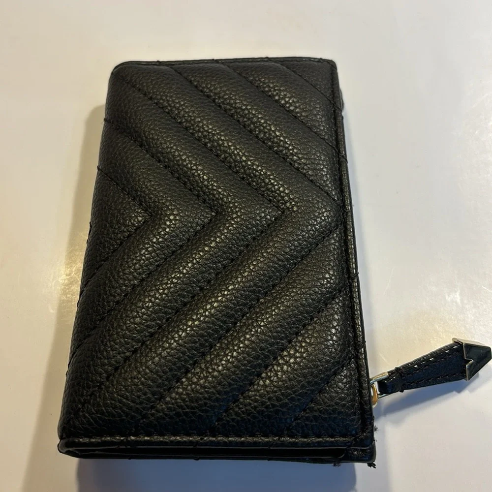Victoria’s Secret small clutch/wallet black with gold color accents.
